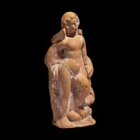 A Greek Terracotta Eros Holding a Club