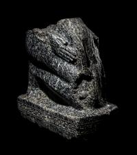 An Egyptian Gneiss Fragment of a Kneeling Figure