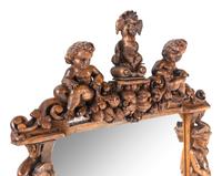 A Renaissance Revival Carved Oak Mirror