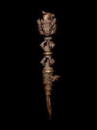 A Tibetan Gilt Bronze Phurba