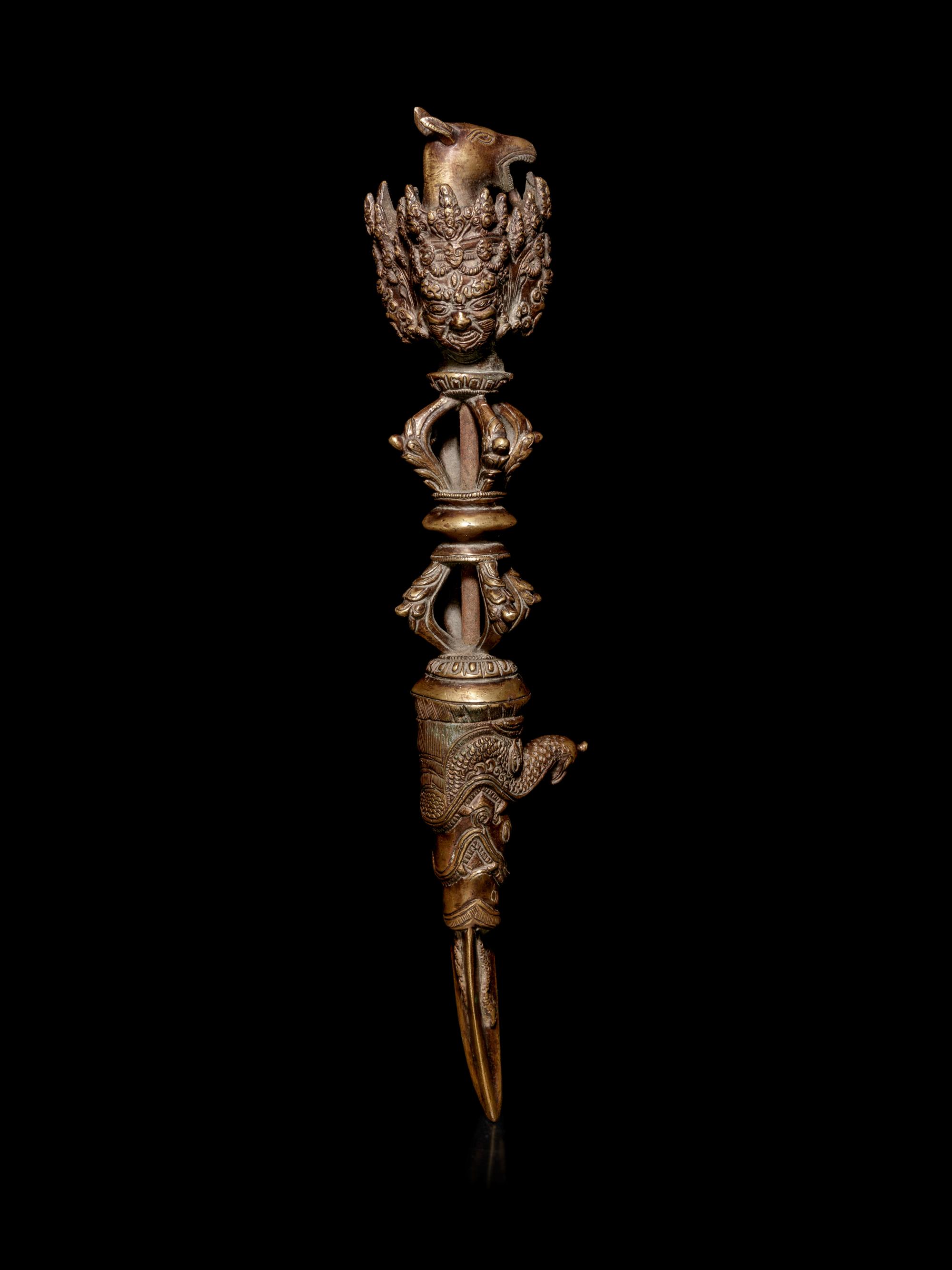 A Tibetan Gilt Bronze Phurba