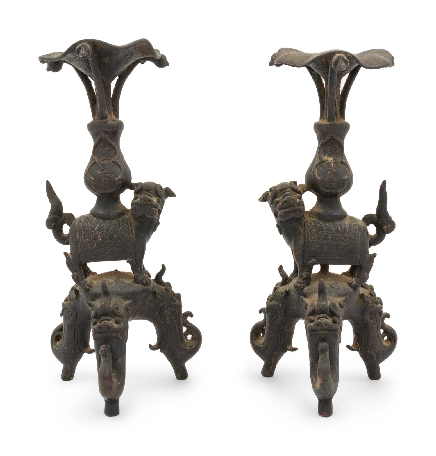 A Pair of Japanese Bronze Mythical Beast-Form Candle Holders