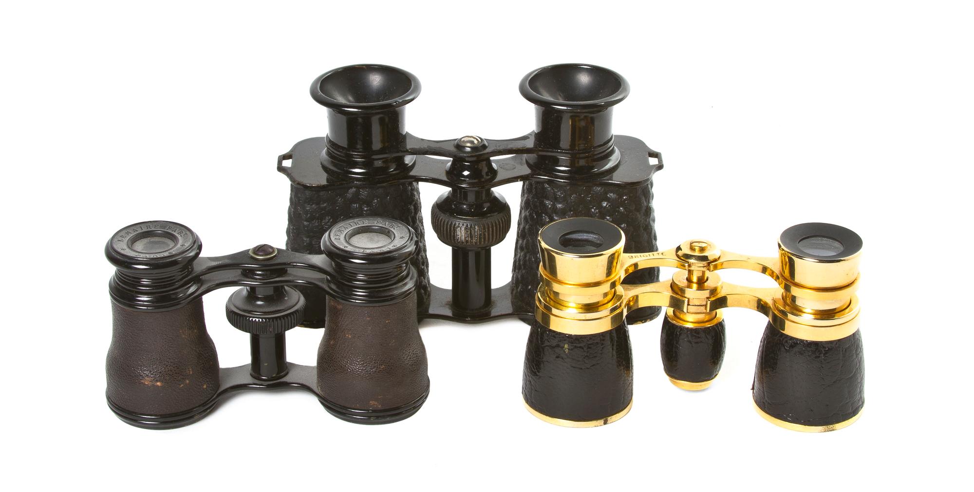 Two Pairs of French Leather Veneered Opera Glasses, Width of widest overall 4 3/4 inches.