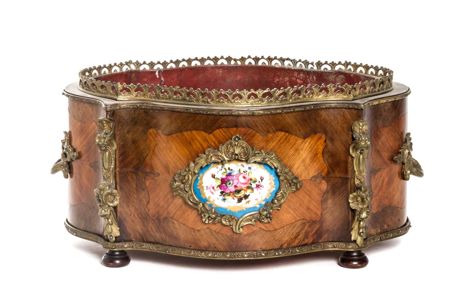 A Napoleon III Gilt Metal Mounted Fruitwood Jardiniere, Width 15 1/4 inches.