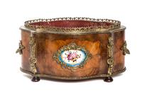 A Napoleon III Gilt Metal Mounted Fruitwood Jardiniere, Width 15 1/4 inches.