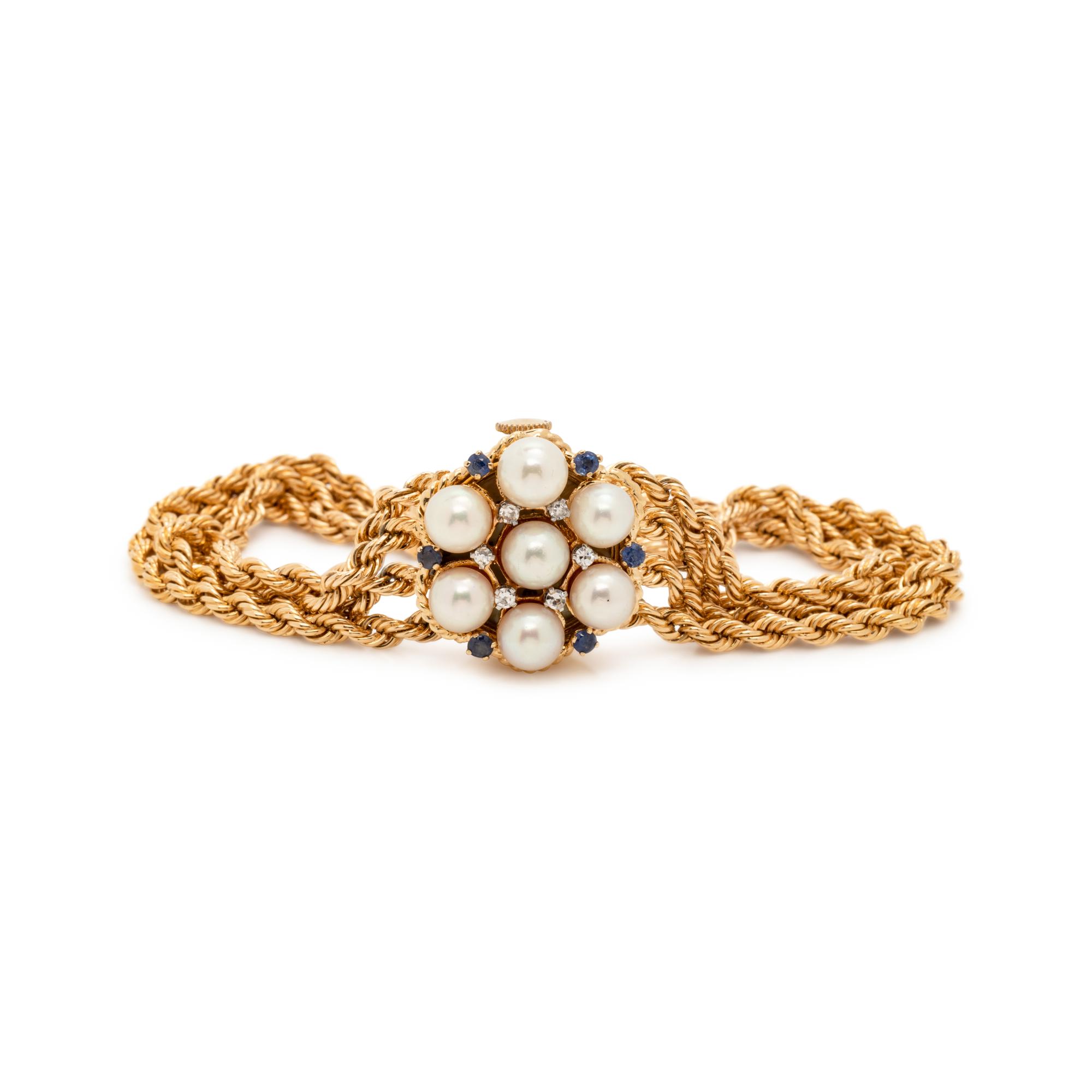 YELLOW GOLD, CULTURED PEARL, DIAMOND AND SYNTHETIC SAPPHIRE SURPRISE WRISTWATCH