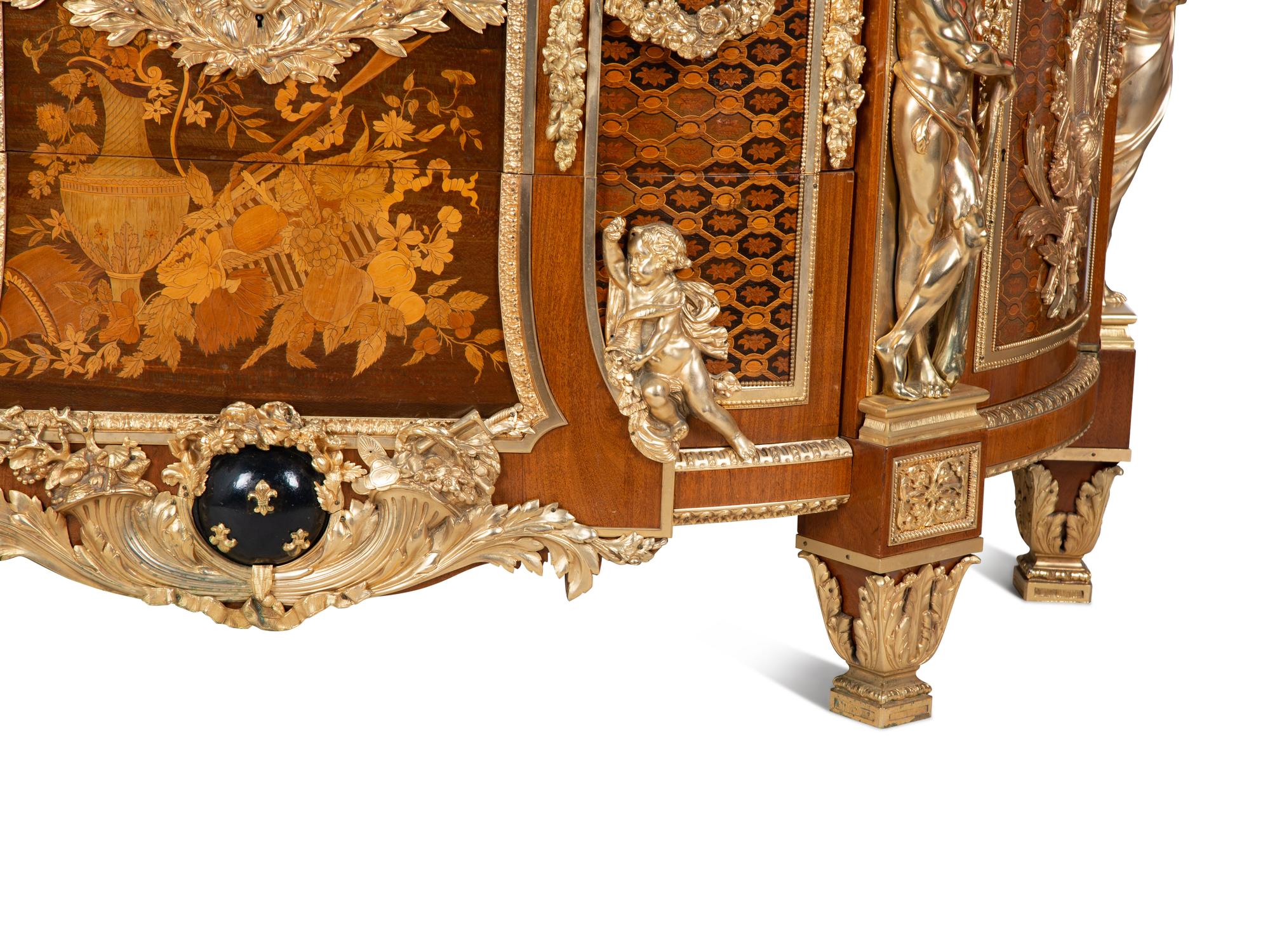 A Louis XVI Style Gilt Bronze Mounted Marquetry Marble-Top Commode After the Model by Jean-Henri Riesener — FIRST HALF 20TH CENTURY