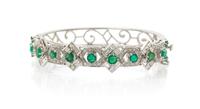 A 14 Karat White Gold, Emerald and Diamond Bangle Bracelet, 16.00 dwts.
