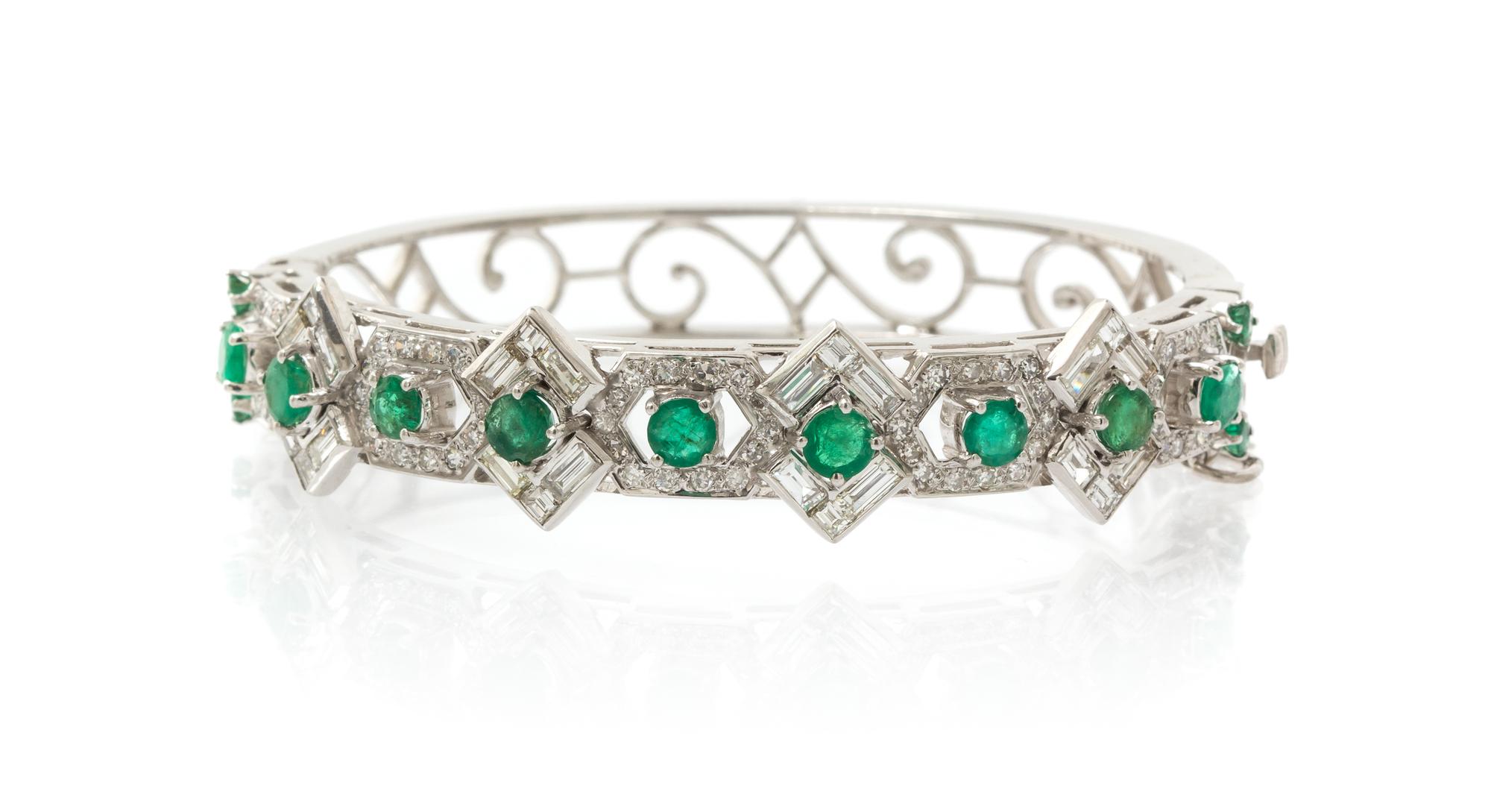 A 14 Karat White Gold, Emerald and Diamond Bangle Bracelet, 16.00 dwts.