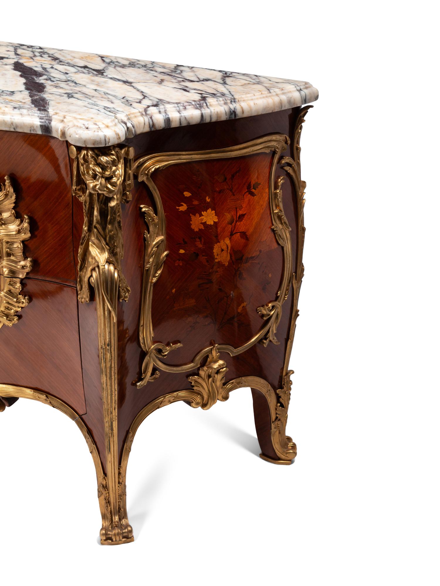 A Pair of Louis XV Style Gilt Bronze Mounted Kingwood and Floral Marquetry Marble-Top Commodes