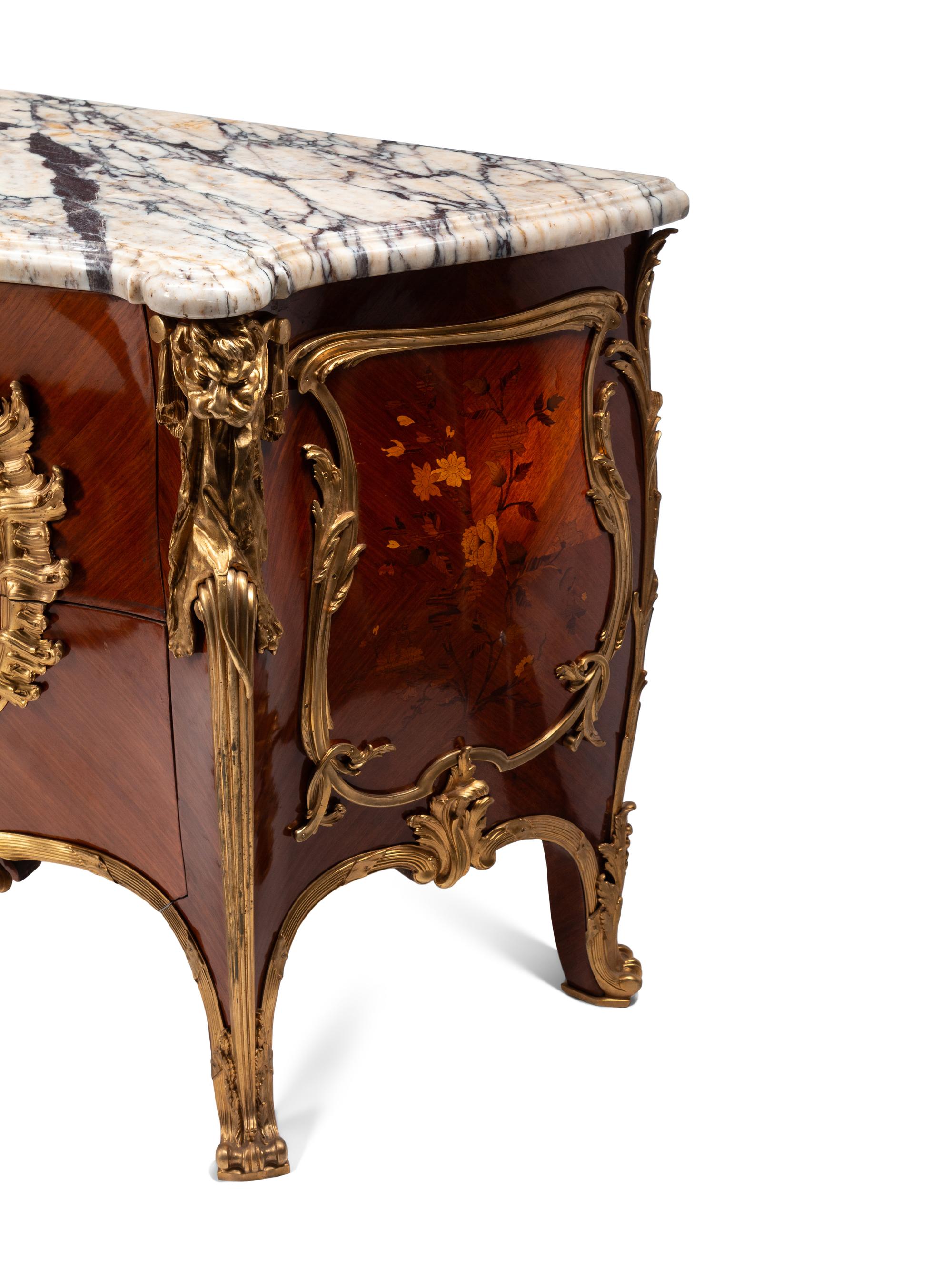 A Pair of Louis XV Style Gilt Bronze Mounted Kingwood and Floral Marquetry Marble-Top Commodes