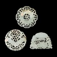 Three Chinese Reticulated White Jade Pendants