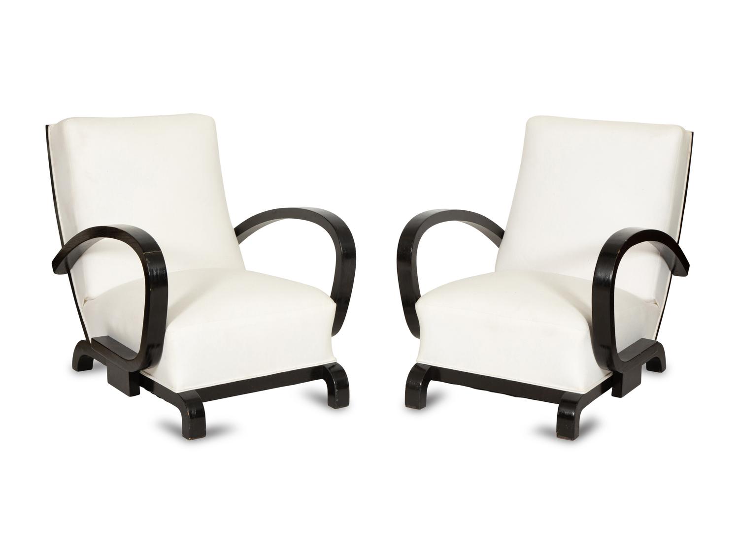 A Pair of Ebonized Oak Lounge Chairs