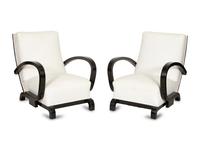 A Pair of Ebonized Oak Lounge Chairs