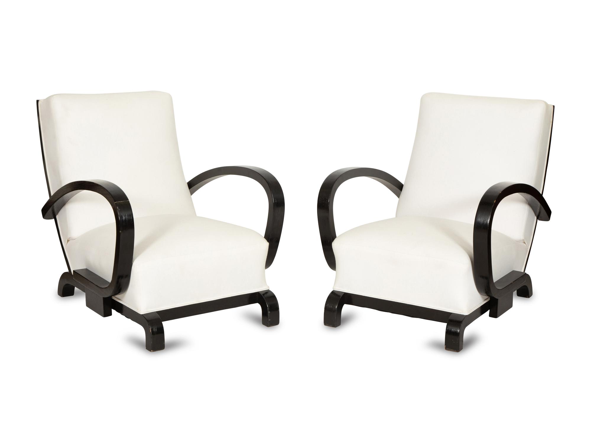 A Pair of Ebonized Oak Lounge Chairs