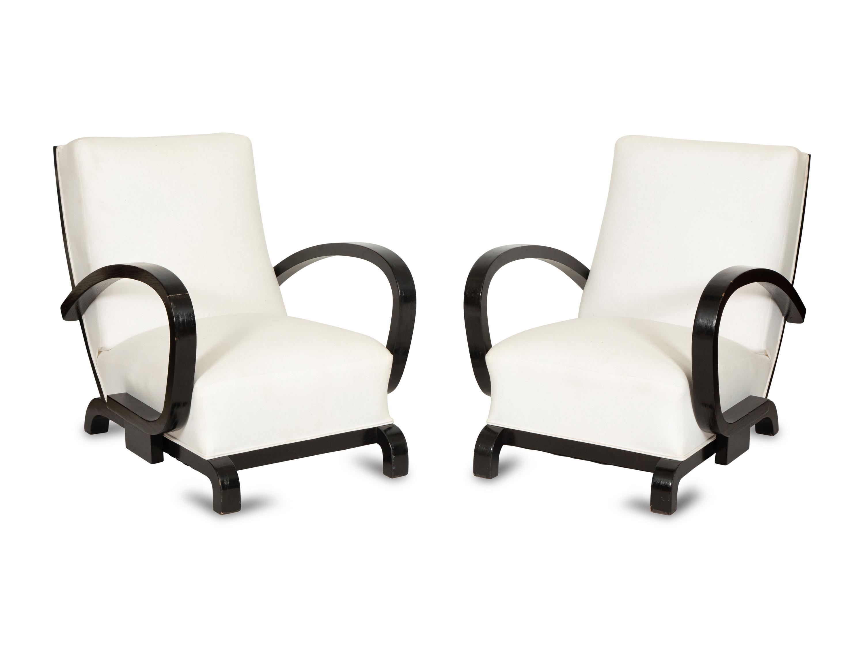 A Pair of Ebonized Oak Lounge Chairs