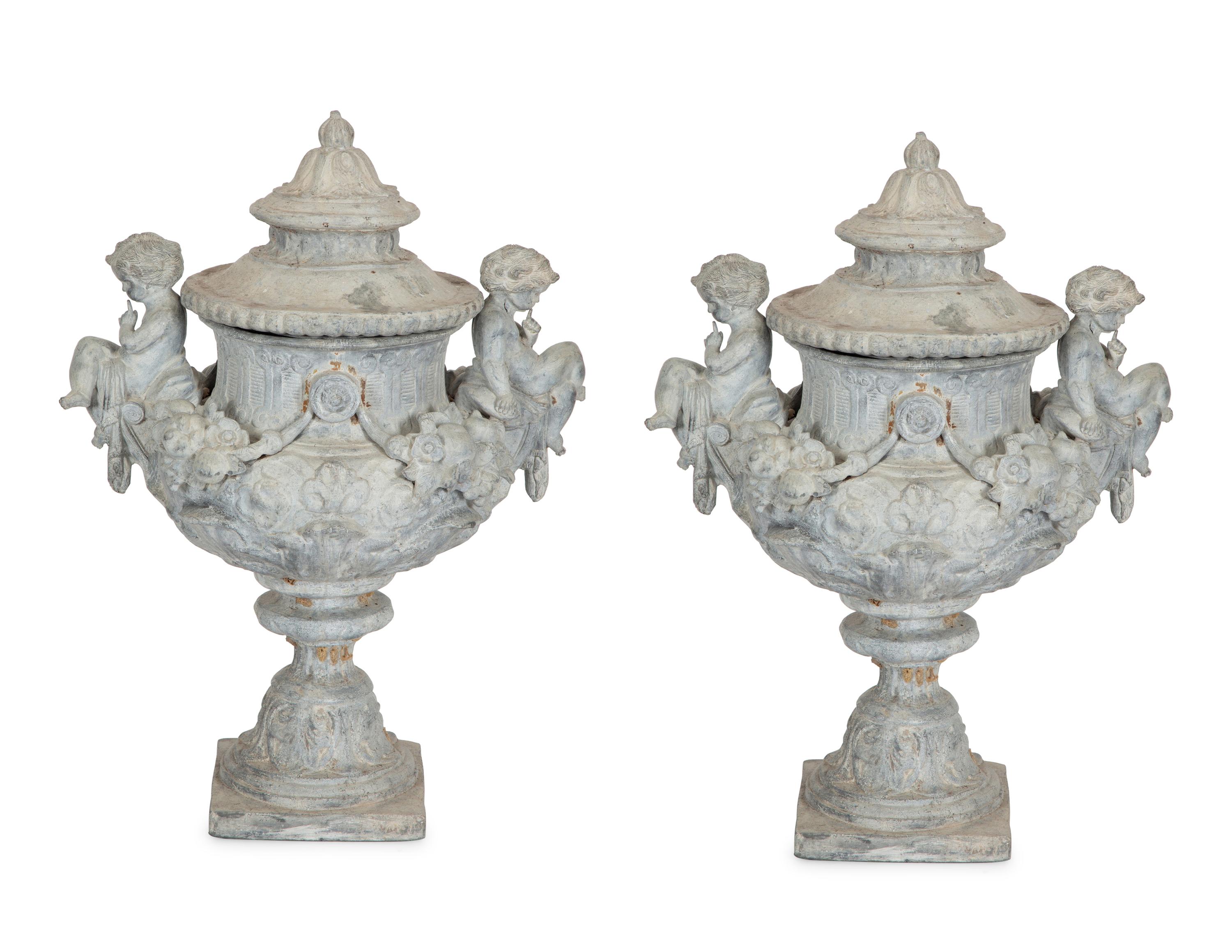A Pair of Classical Style Cast Stone Covered Urns