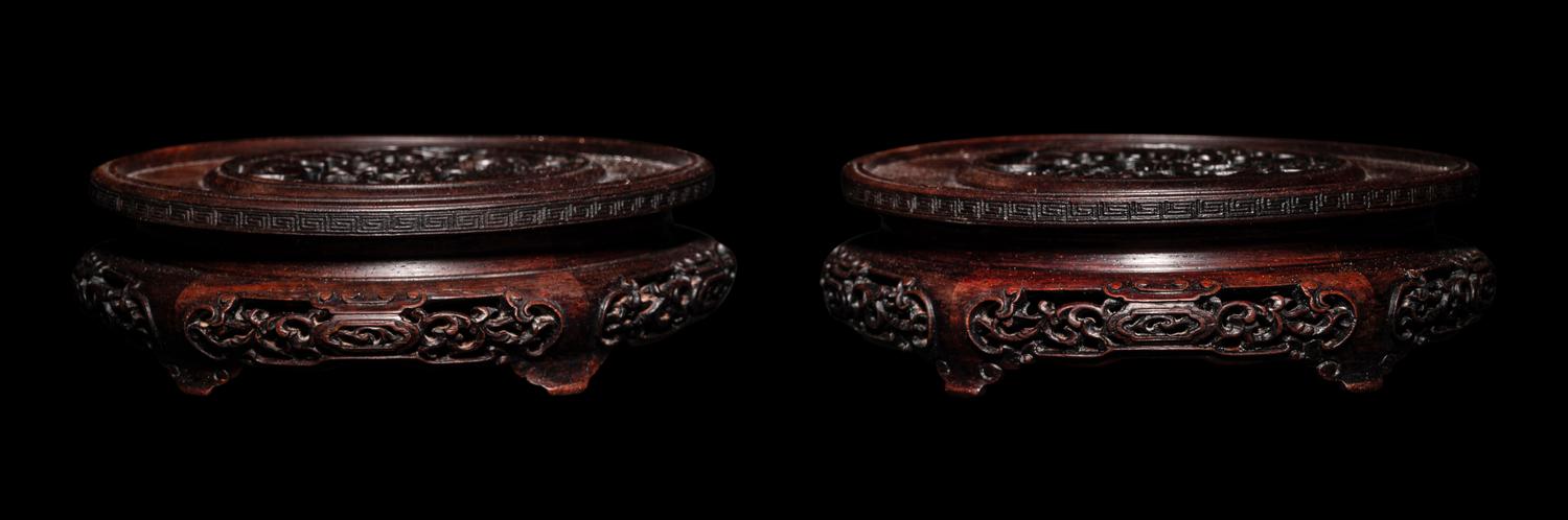A Pair of Chinese Carved Hardwood Circular Stands