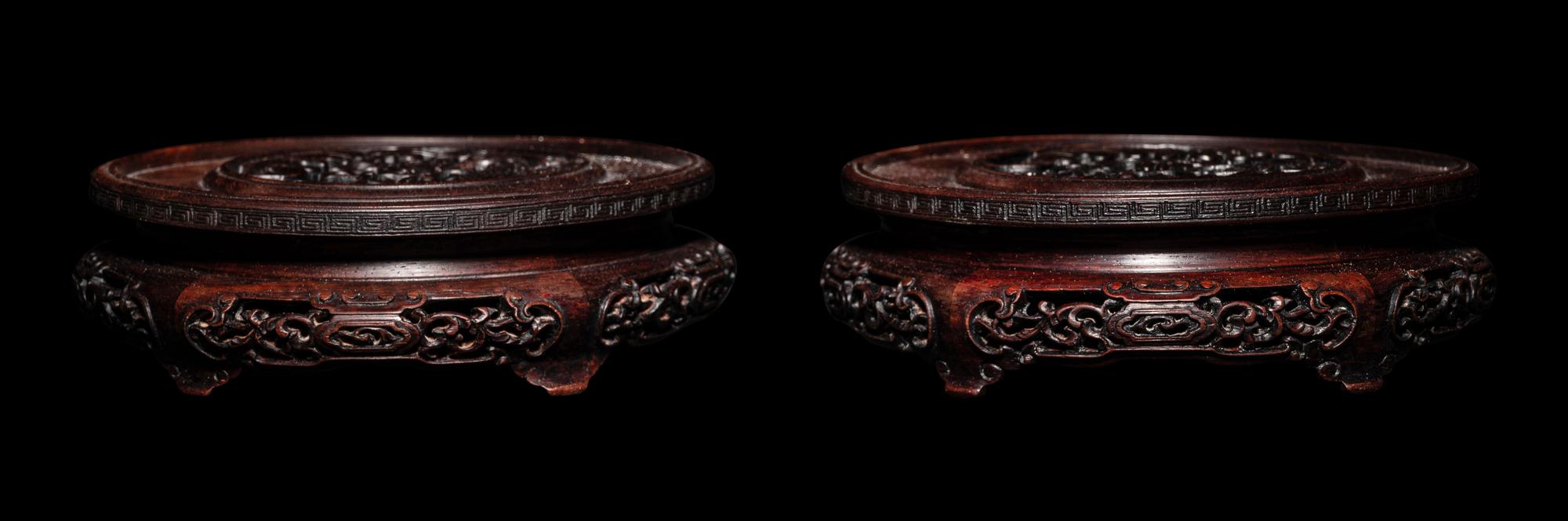 A Pair of Chinese Carved Hardwood Circular Stands