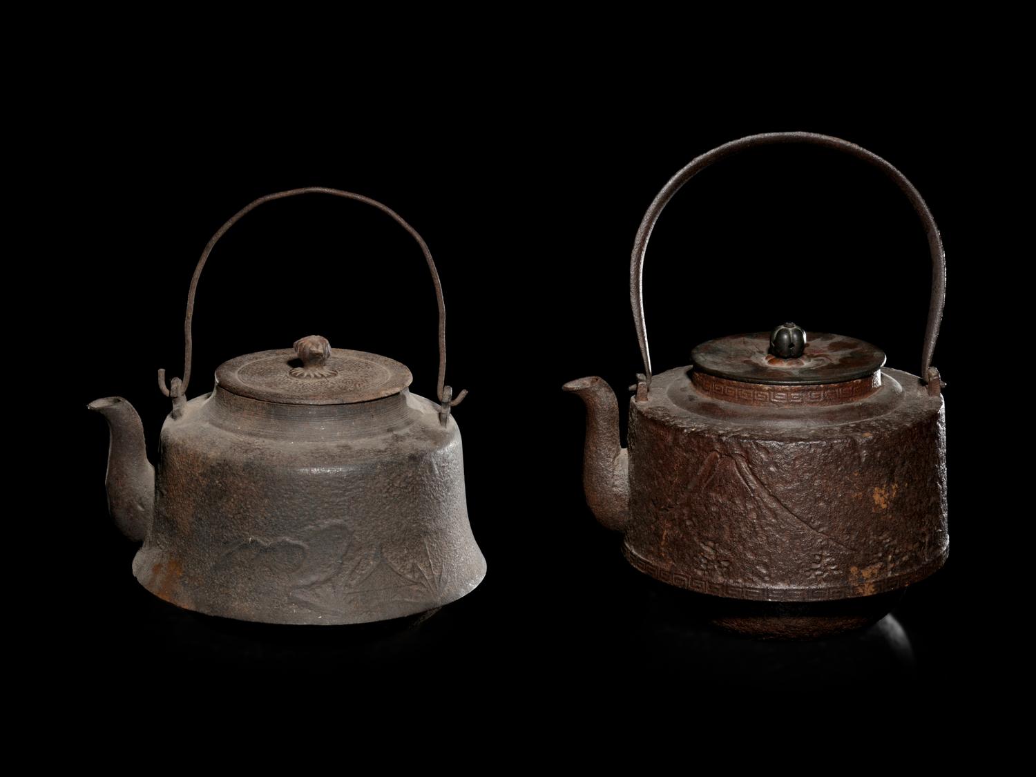Seven Japanese Cast Iron Teapots, Tetsubin, and Burner