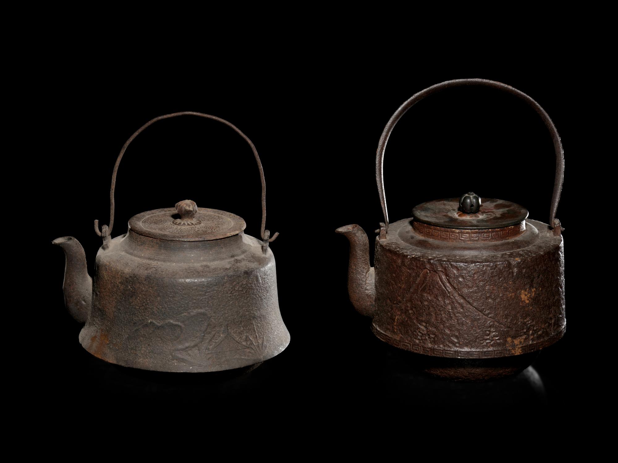 Seven Japanese Cast Iron Teapots, Tetsubin, and Burner