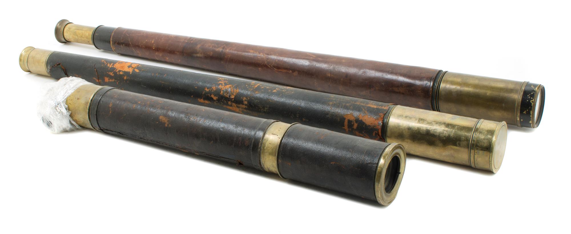 A Group of Three Leather Cased Telescopes Length of longest 37 inches.