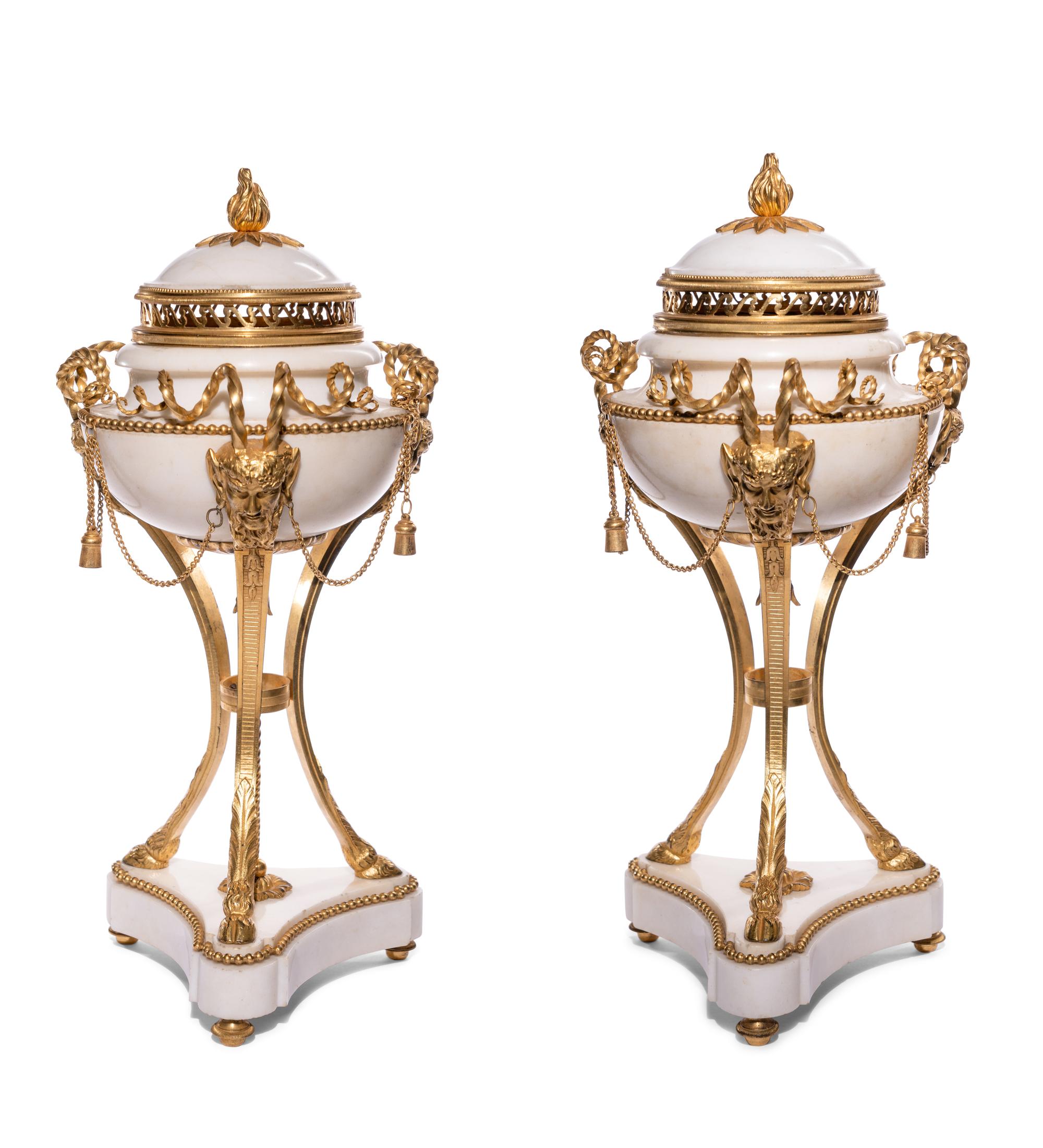 A Pair of Late Louis XVI Gilt Bronze Mounted White Marble Cassolettes