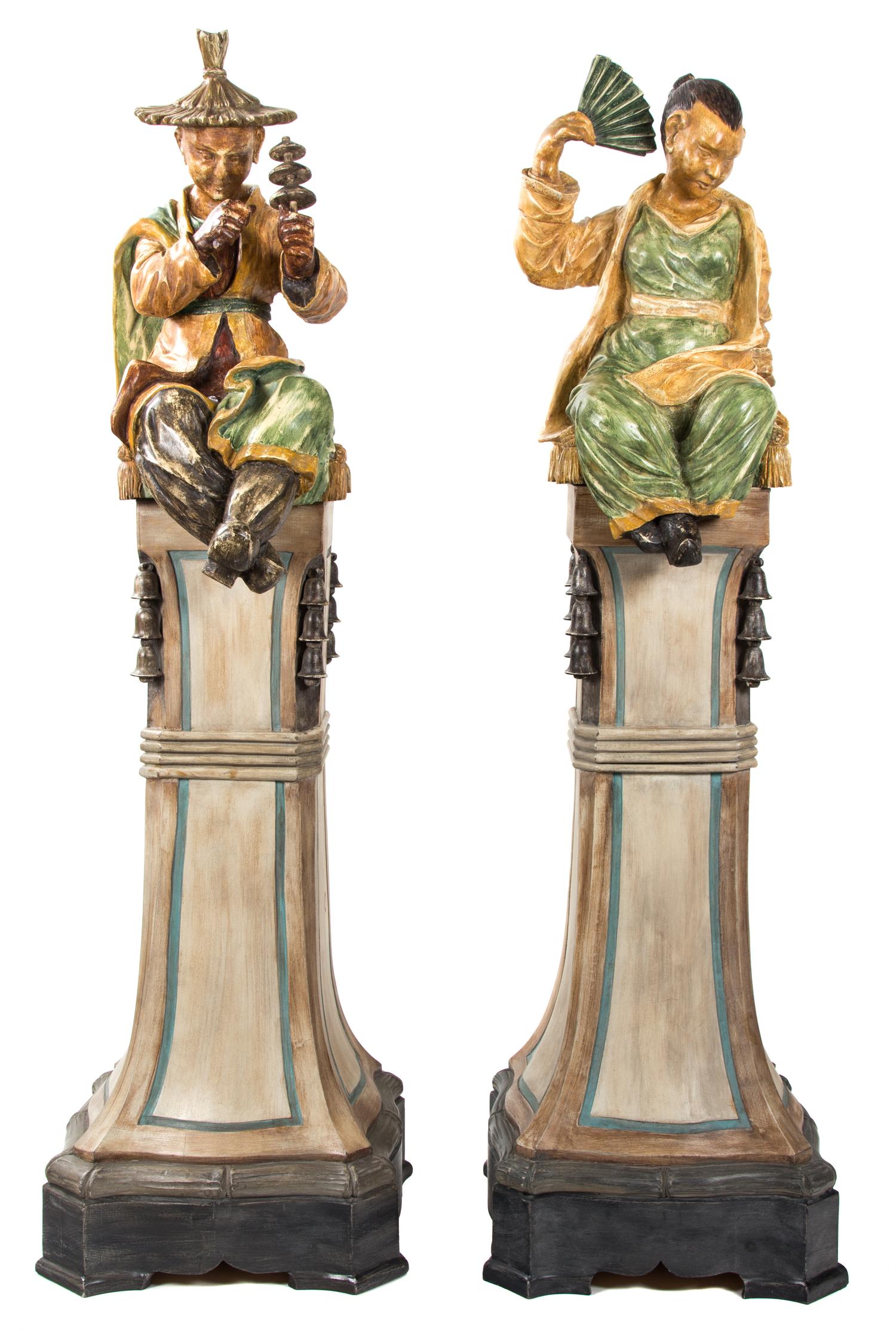 A Pair of Painted Resin Figures Height 66 inches. — 20TH CENTURY