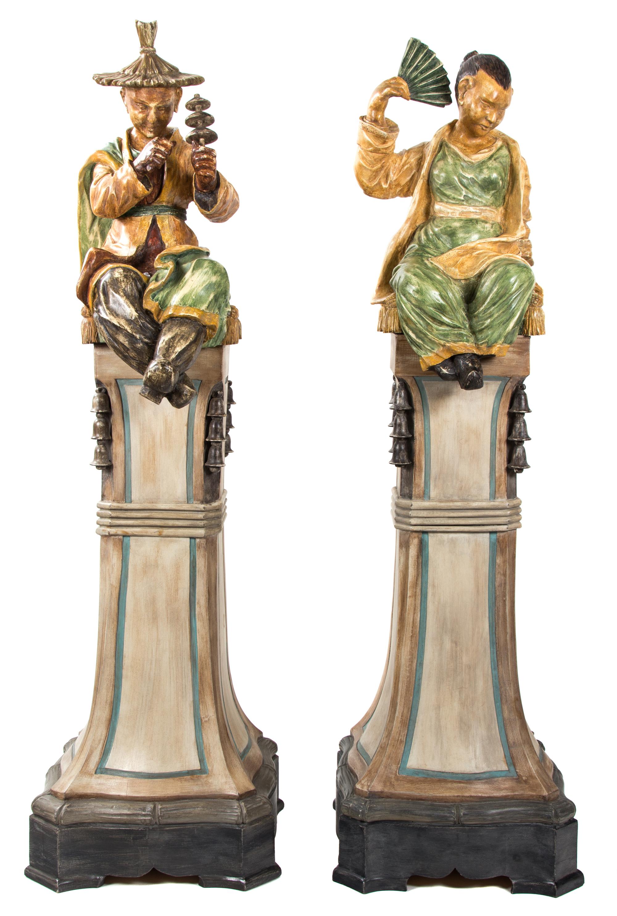 A Pair of Painted Resin Figures Height 66 inches. — 20TH CENTURY