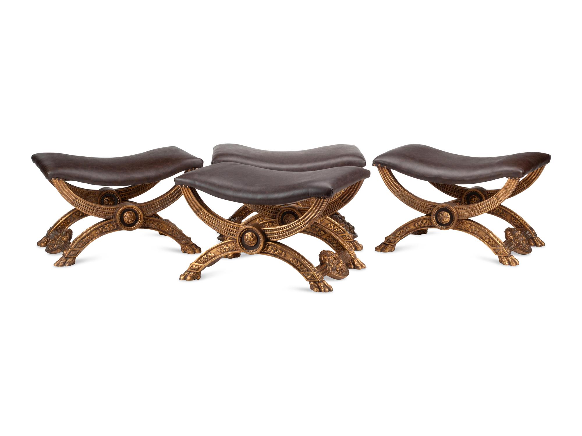 A Set of Four Italian Neoclassical Style Giltwood Benches with Leather Upholstery