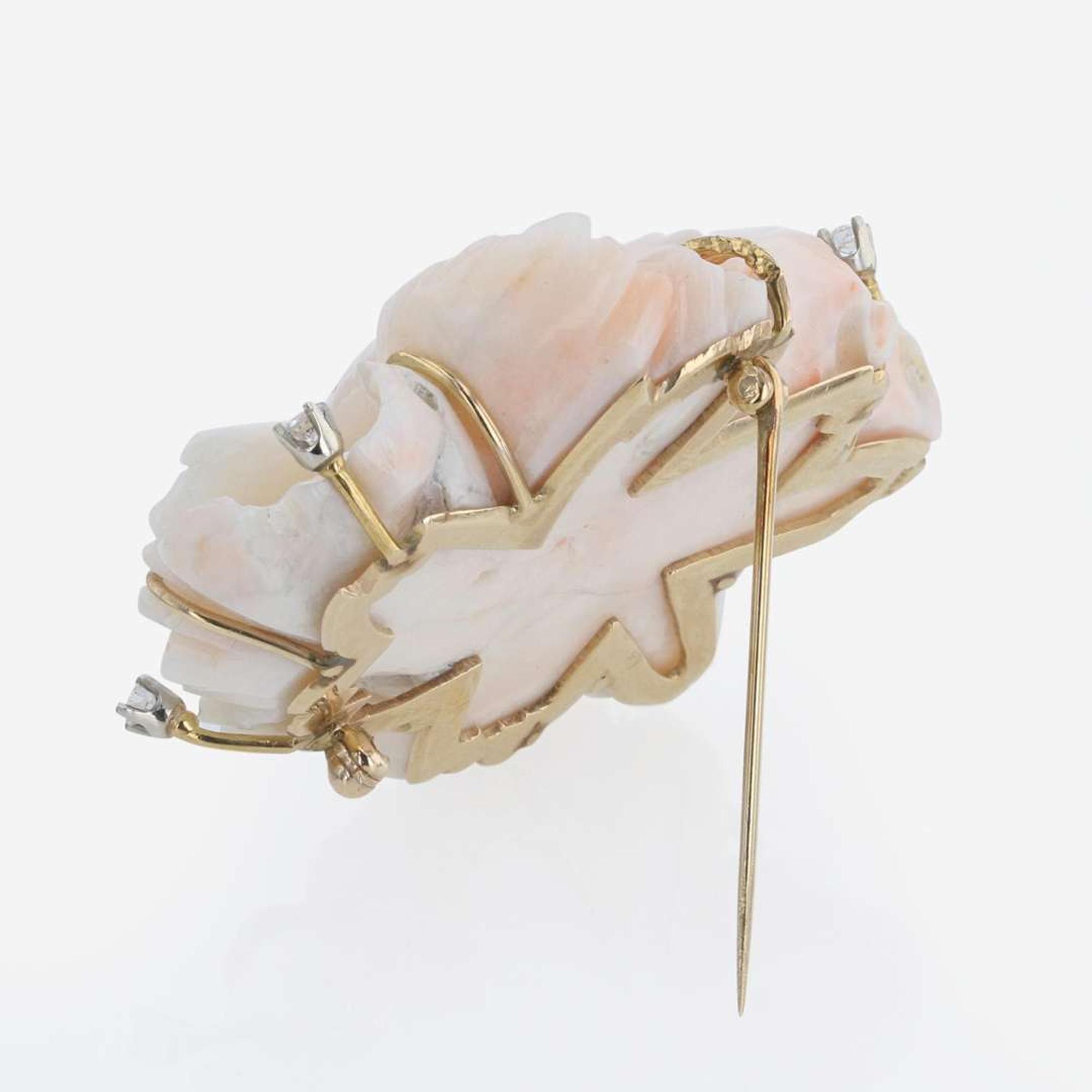 A Carved Coral, Diamond, and 14K Yellow Gold Brooch