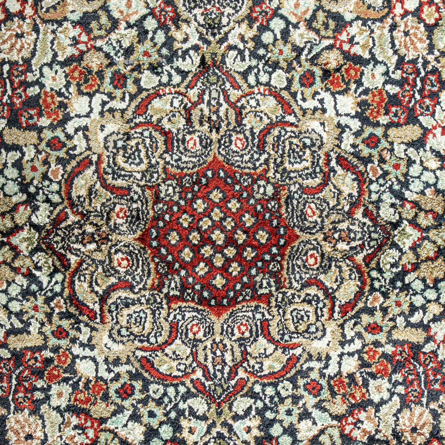 A Silk Tabriz Rug