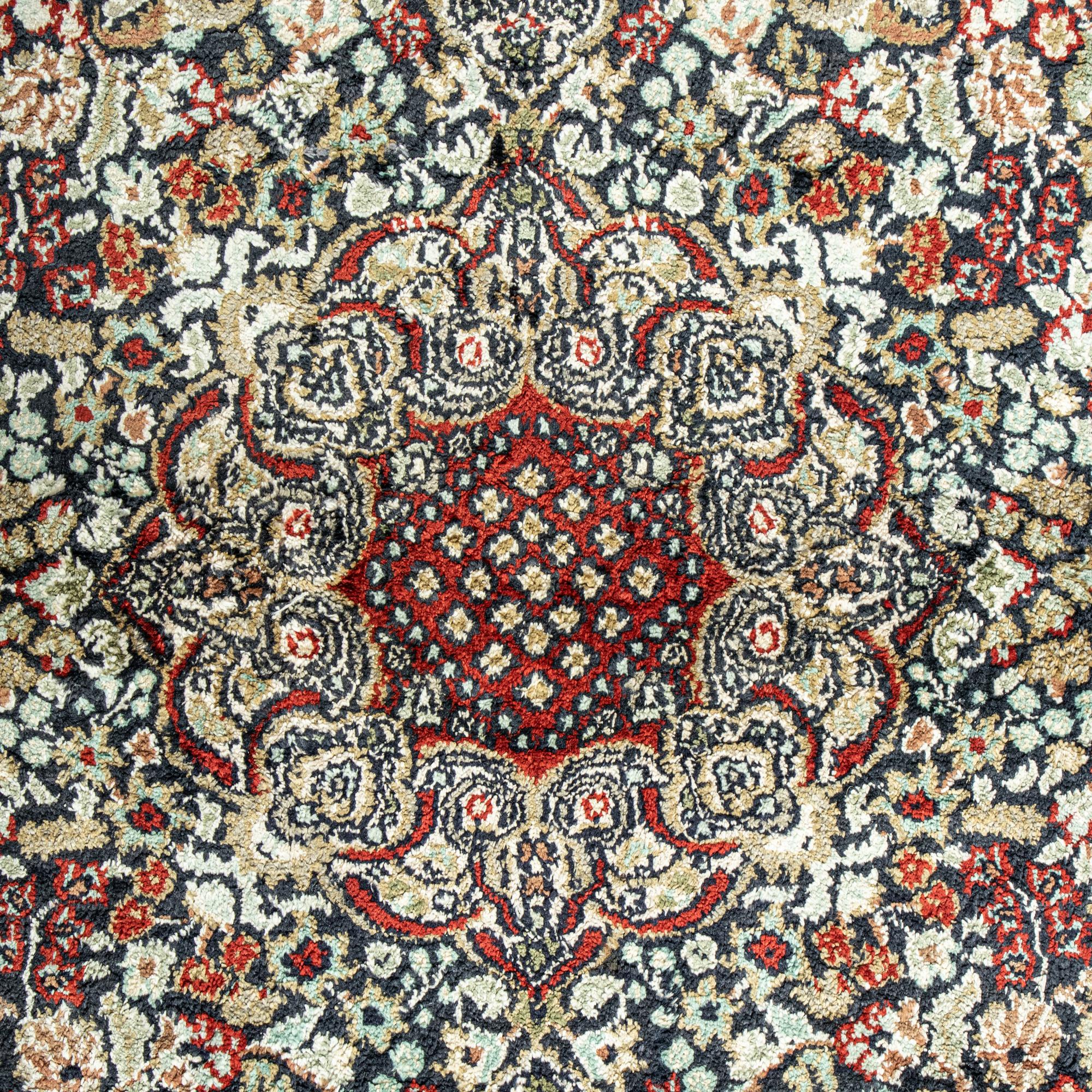 A Silk Tabriz Rug