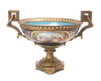 A Sevres Style Gilt Bronze Mounted Porcelain Center Bowl Height 9 1/2 x diameter 16 1/2 inches.