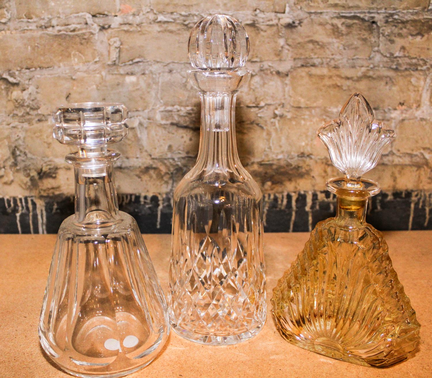 A Baccarat Glass Decanter Height of first 9 1/2 inches. — 20TH CENTURY
