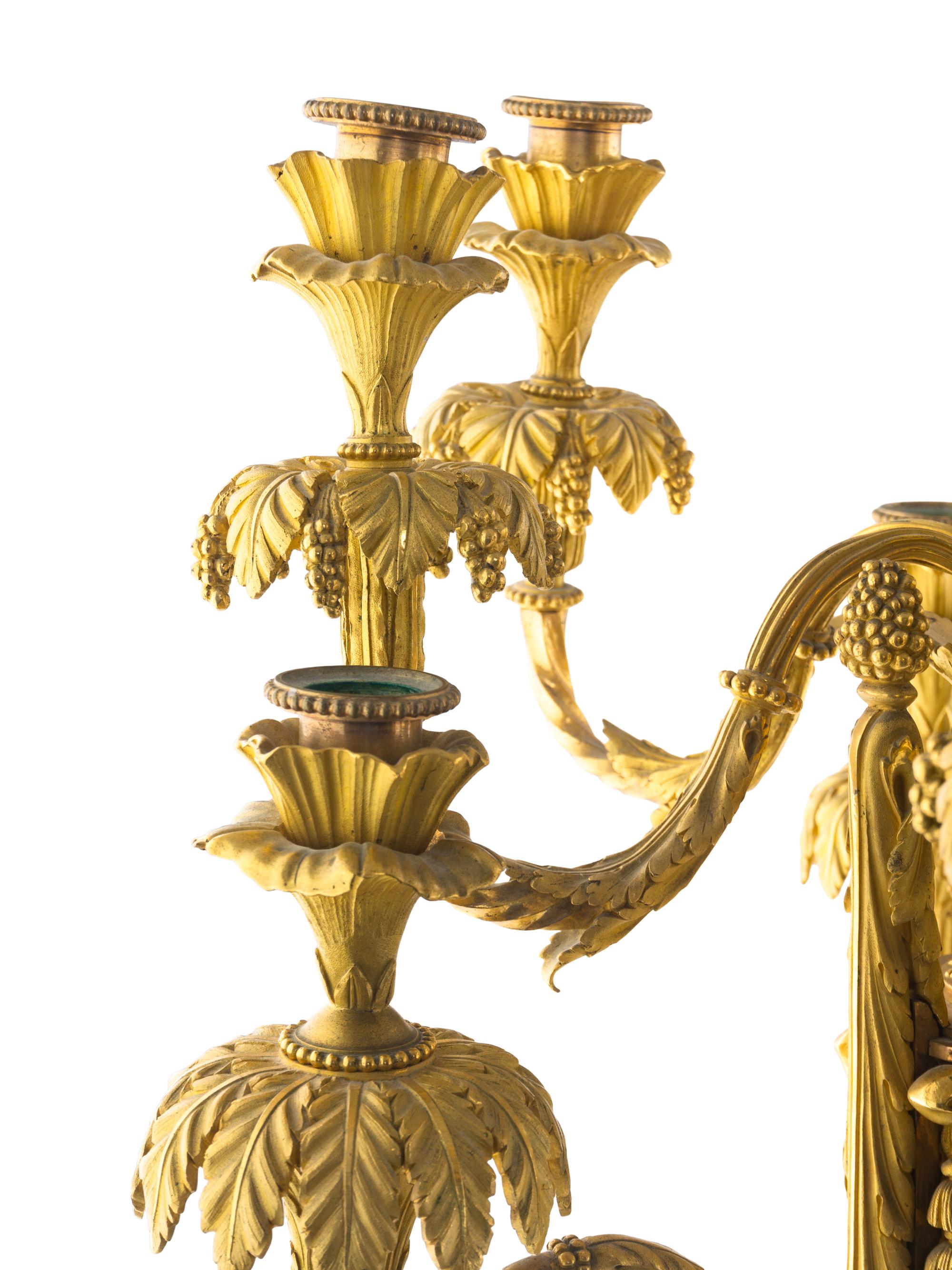 A Pair of Louis XVI Style Gilt Bronze and White Marble Ten-Light Candelabra