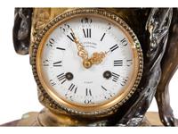 A Napoleon III Gilt and Silvered Bronze and Rouge Griotte Marble Figural Clock