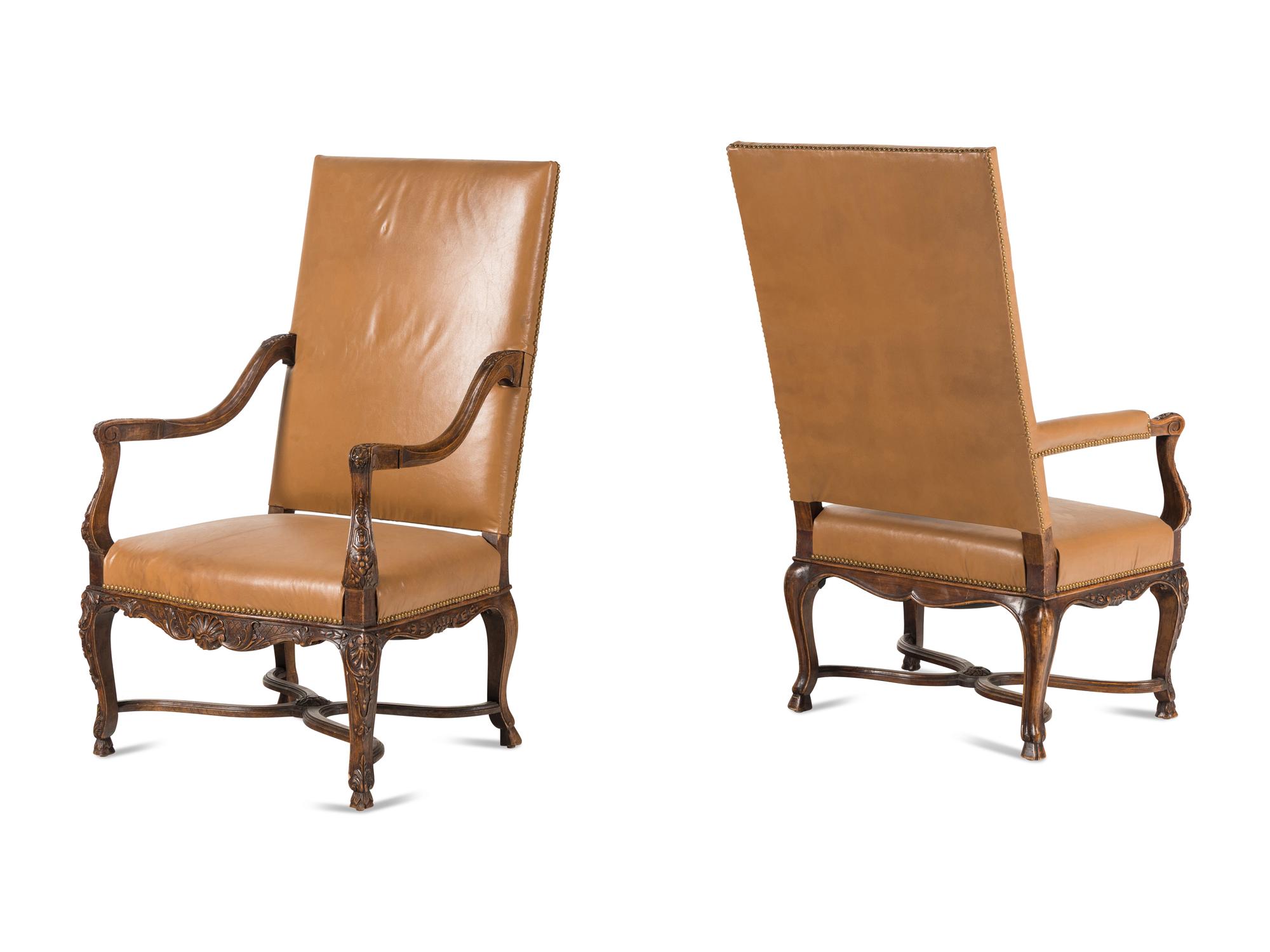 A Matched Pair of Régence Style Walnut Fauteuils