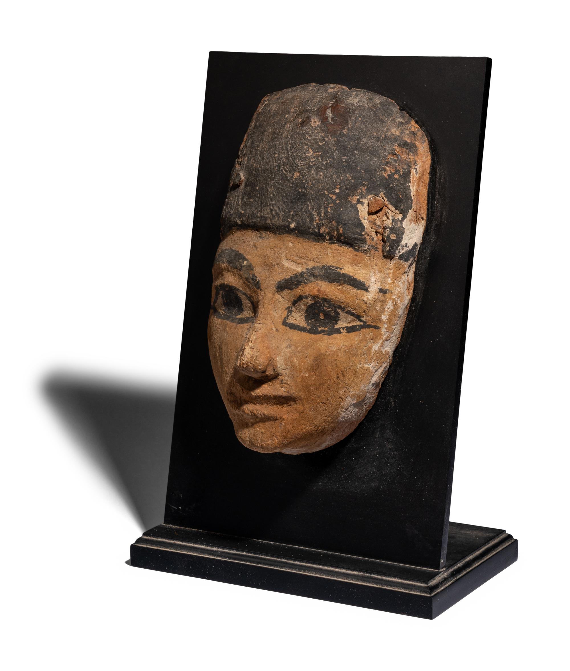An Egyptian Painted Wood Mummy Mask
