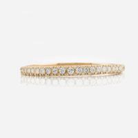 A gold and diamond bangle bracelet
