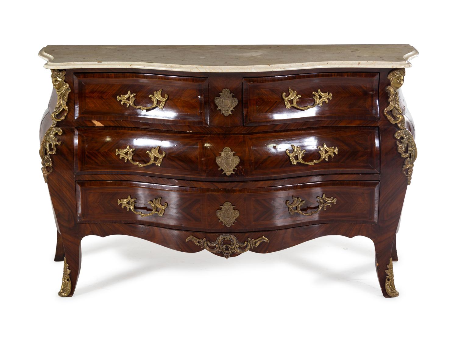 A Régence Style Gilt Bronze Mounted Tulipwood Commode