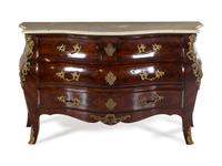 A Régence Style Gilt Bronze Mounted Tulipwood Commode