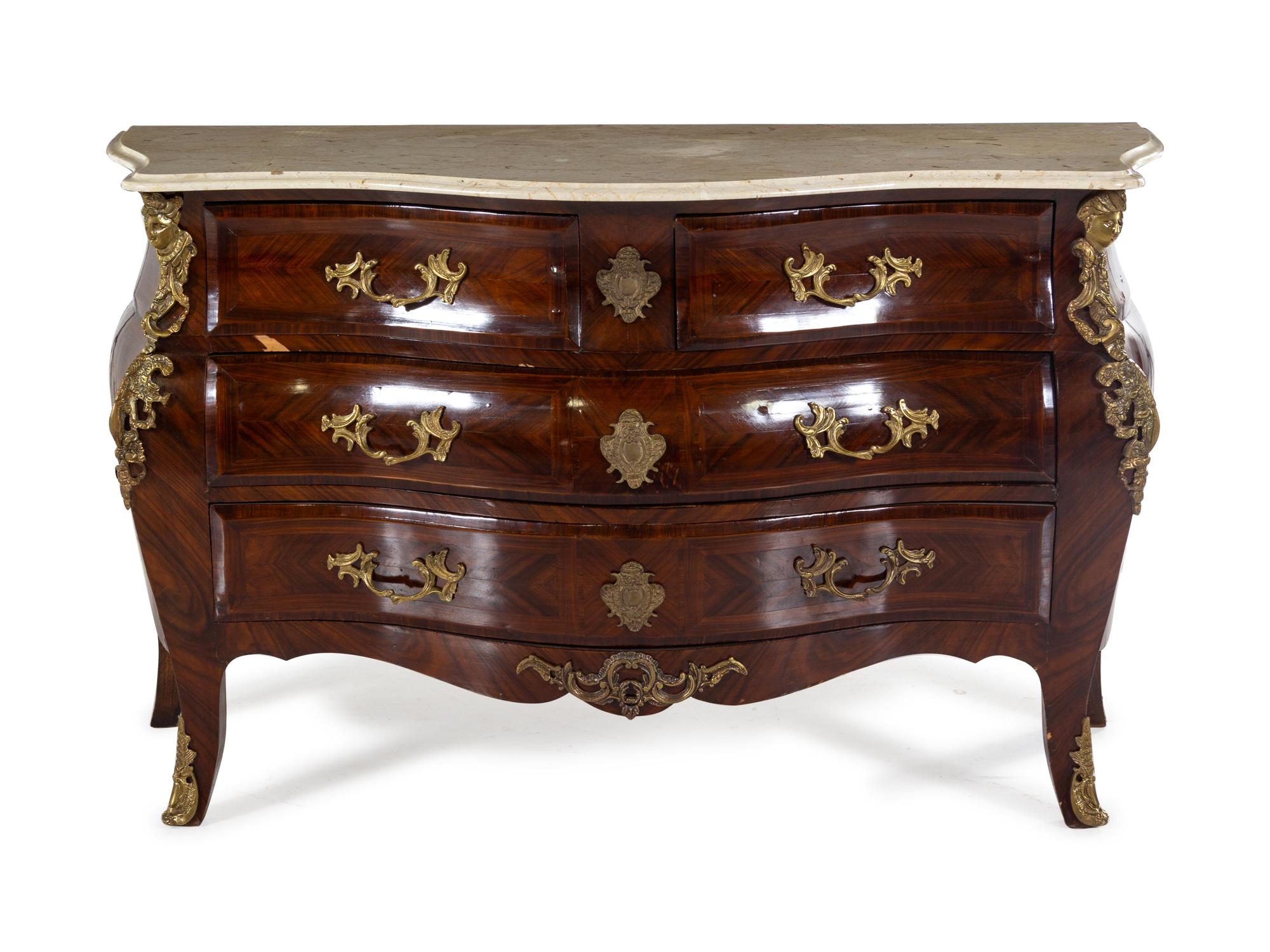 A Régence Style Gilt Bronze Mounted Tulipwood Commode