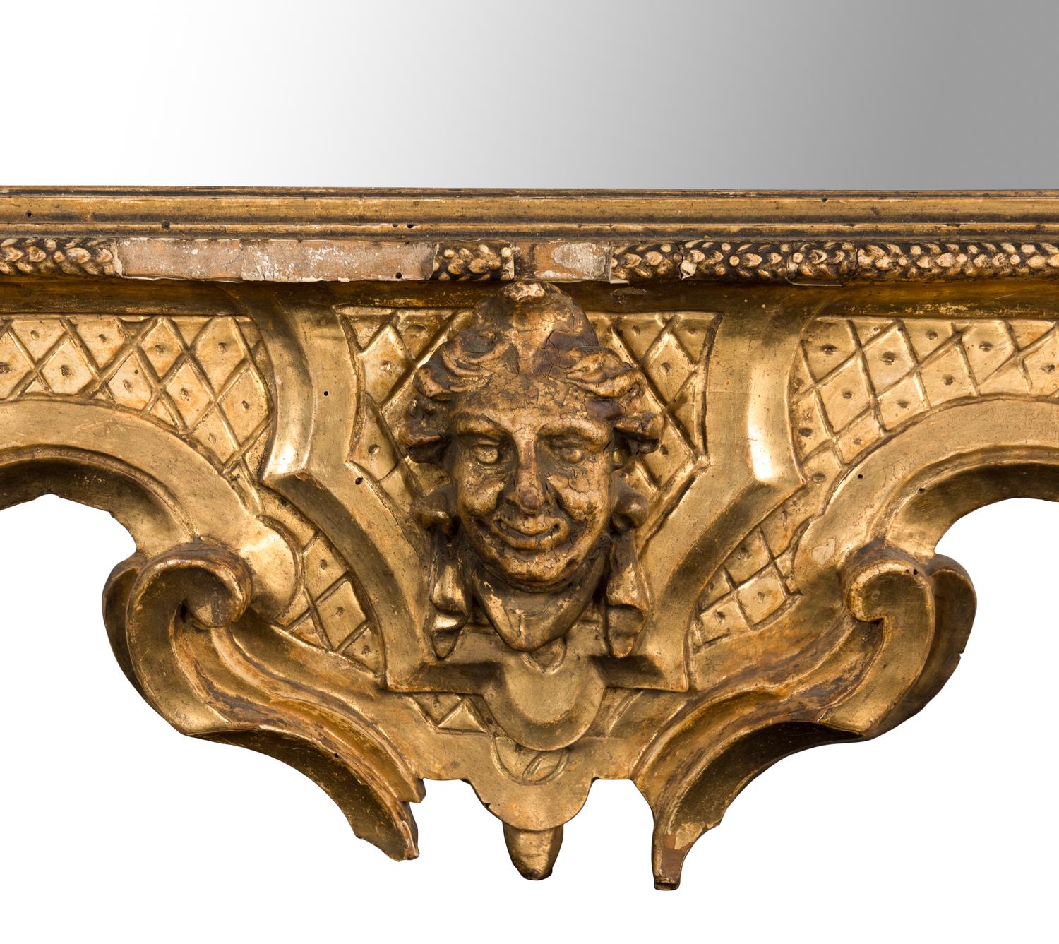 An Italian Rococo Carved Giltwood Mirror