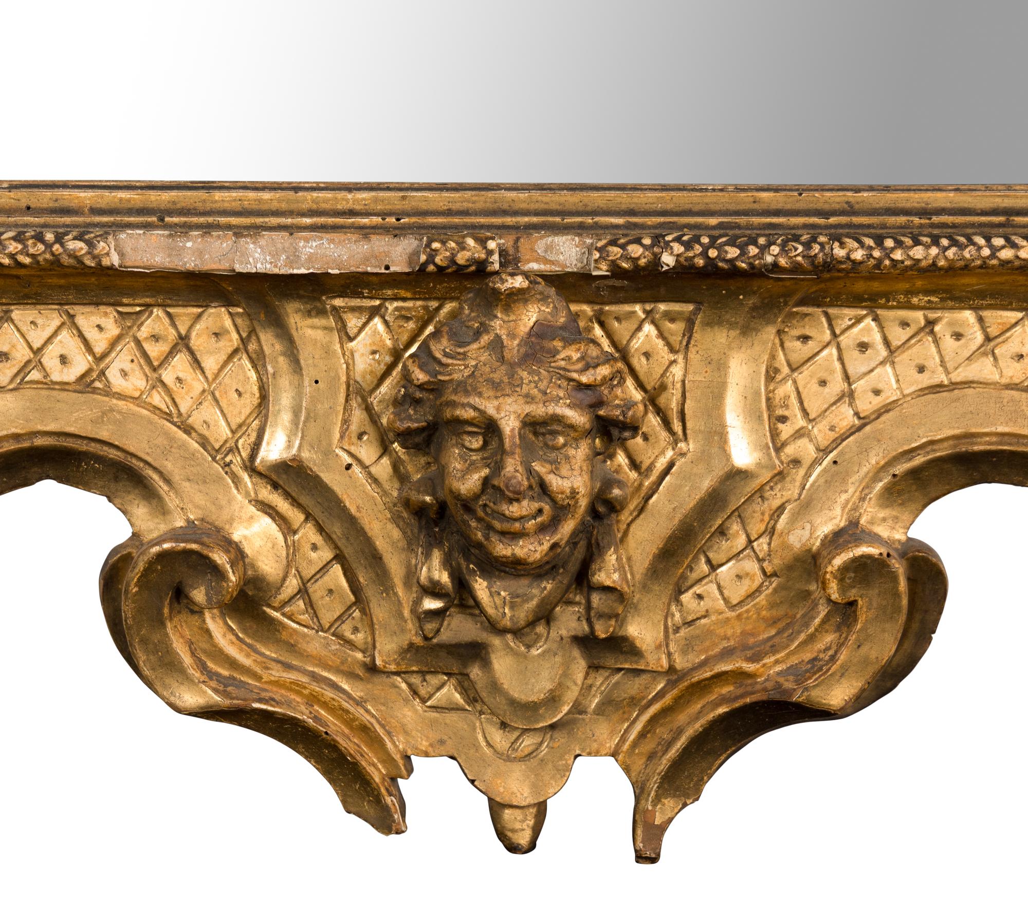 An Italian Rococo Carved Giltwood Mirror