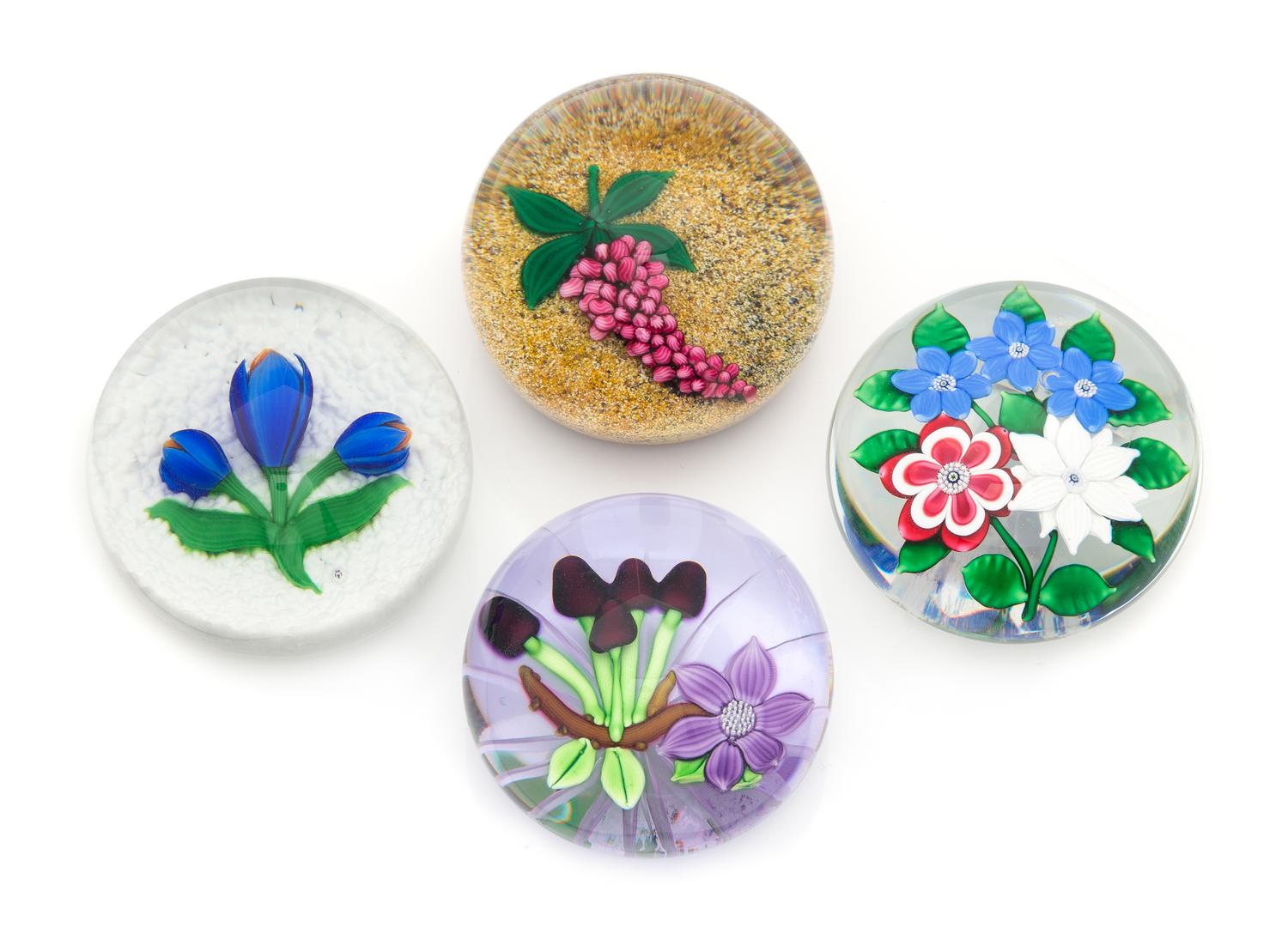 Four Glass Paperweights Diameter of largest 3 1/4 inches