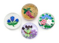 Four Glass Paperweights Diameter of largest 3 1/4 inches