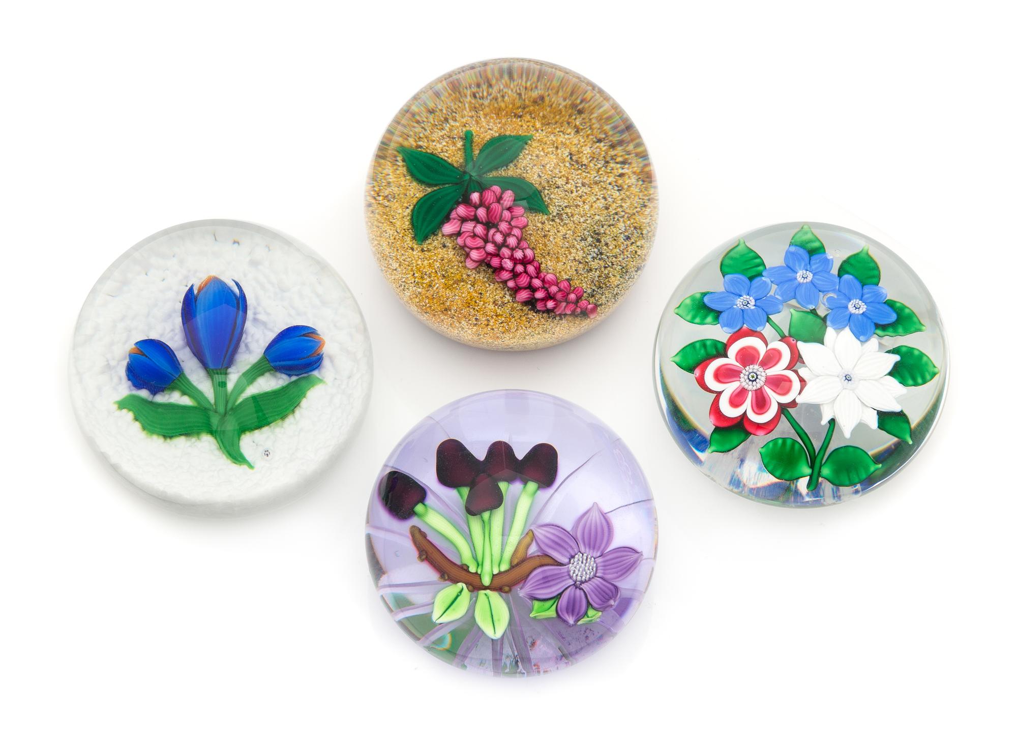 Four Glass Paperweights Diameter of largest 3 1/4 inches