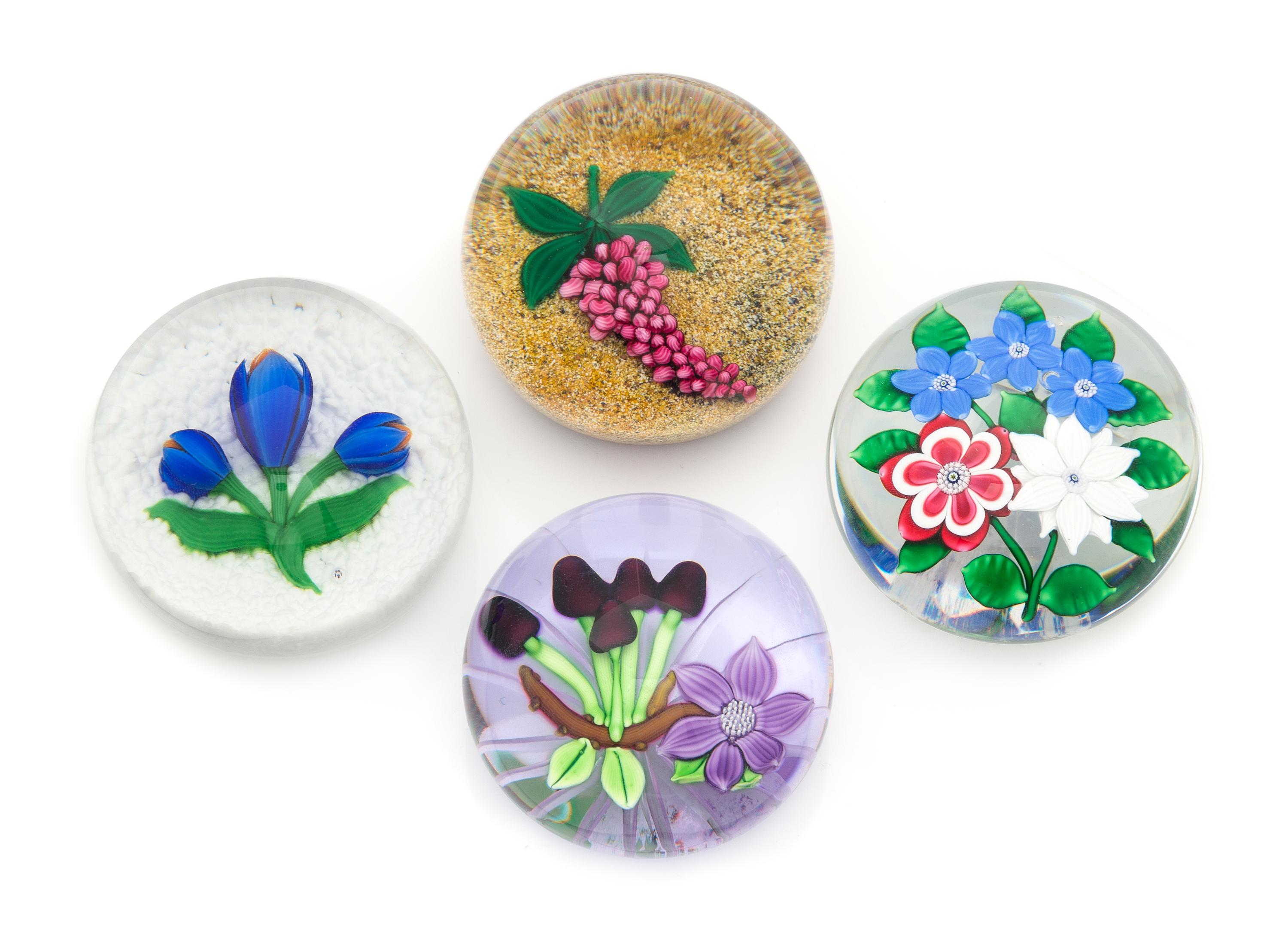 Four Glass Paperweights Diameter of largest 3 1/4 inches