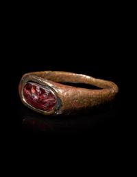 A Roman Bronze and Carnelian Finger Ring